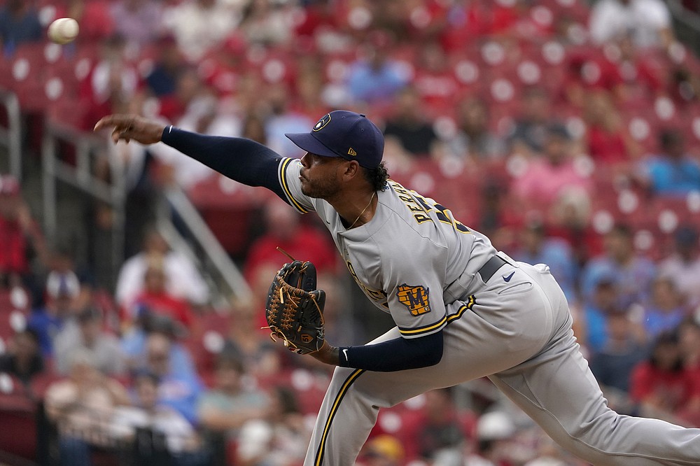 Milwaukee Brewers starting pitcher Freddy Peralta throws during the first inning of a baseball game against the St. Louis Cardinals Wednesday, Aug. 18, 2021, in St. Louis. (AP Photo/Jeff Roberson)