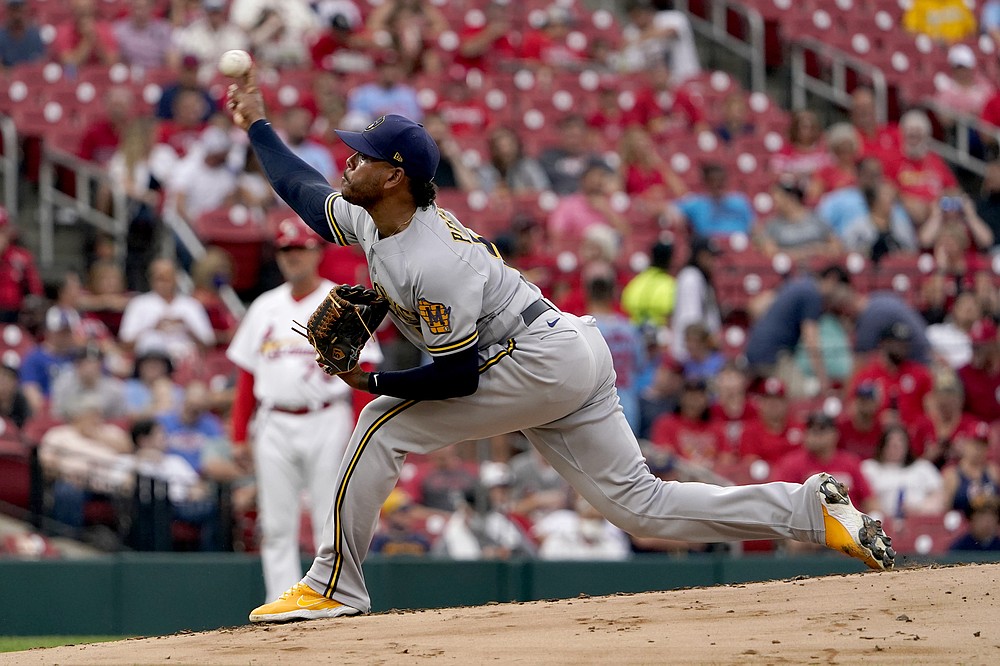 Milwaukee Brewers starting pitcher Freddy Peralta throws during the first inning of a baseball game against the St. Louis Cardinals Wednesday, Aug. 18, 2021, in St. Louis. (AP Photo/Jeff Roberson)