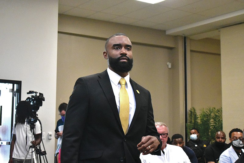 Solomon Bozeman walks into the STEM conference center to be introduced as UAPB men's basketball coach on Tuesday. (Pine Bluff Commercial/I.C. Murrell)