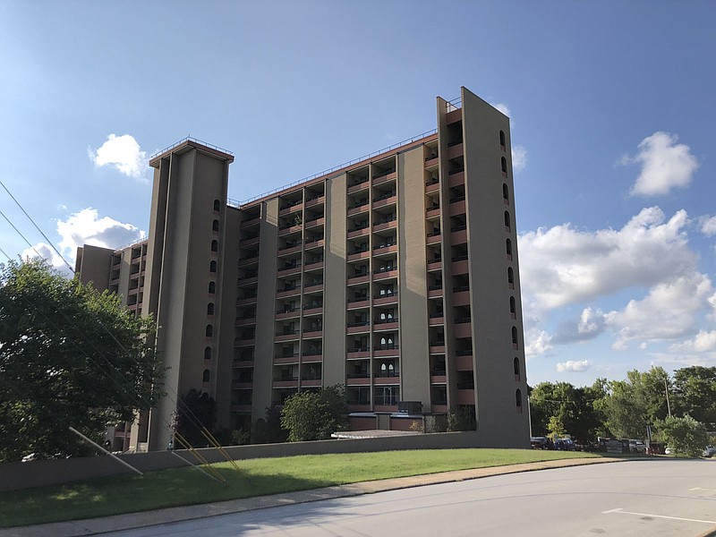 Hillcrest Towers, the site of the Fayetteville Housing Authority office, is seen Wednesday, Aug. 18, 2021, at 1 N. School Ave. in Fayetteville. (NWA Democrat-Gazette/Stacy Ryburn)
