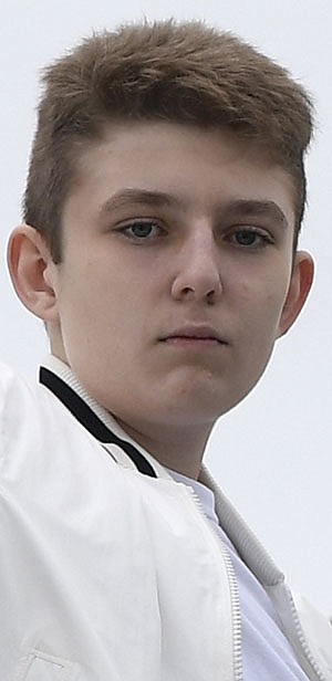 FILE - In this Aug. 16, 2020 file photo, Barron Trump is shown at Morristown Municipal Airport in Morristown, N.J. (AP Photo/Susan Walsh)