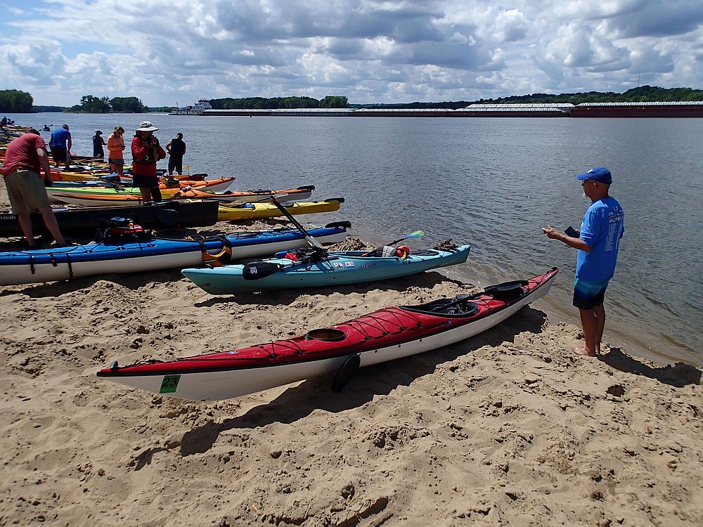A boat pushing barges, called a tow in river lingo, passes the group Aug. 3 2021 during a sandbar break.
(NWA Democrat-Gazette/Flip Putthoff)