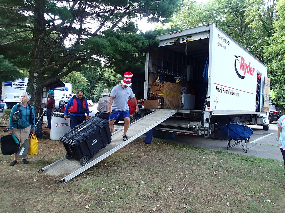 Rumblers load their gear on to rental trucks the morning of Aug. 5 2021. Volunteers transport camping and personal gear to the next overnight town each day. Everyone helping on the Great River Rumble is a volunteer. No one is paid.
(NWA Democrat-Gazette/Flip Putthoff)