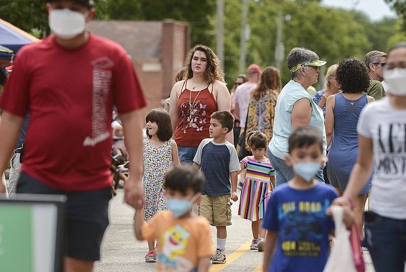 People walk around, Saturday, August 21, 2021 during the Farmer's Market at the downtown square in Bentonville. Northwest Arkansas grew in population in the latest U.S. Census. Check out nwaonline.com/210822Daily/ for today's photo gallery. 
(NWA Democrat-Gazette/Charlie Kaijo)