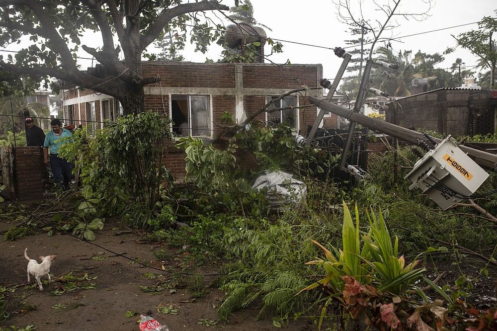 A man inspects the damage on his property in the aftermath of Hurricane Grace, in Tecolutla, Veracruz State, Mexico, Saturday, Aug. 21, 2021. Grace hit Mexico&#x2019;s Gulf shore as a major Category 3 storm before weakening on Saturday, drenching coastal and inland areas in its second landfall in the country in two days. (AP Photo/Felix Marquez)