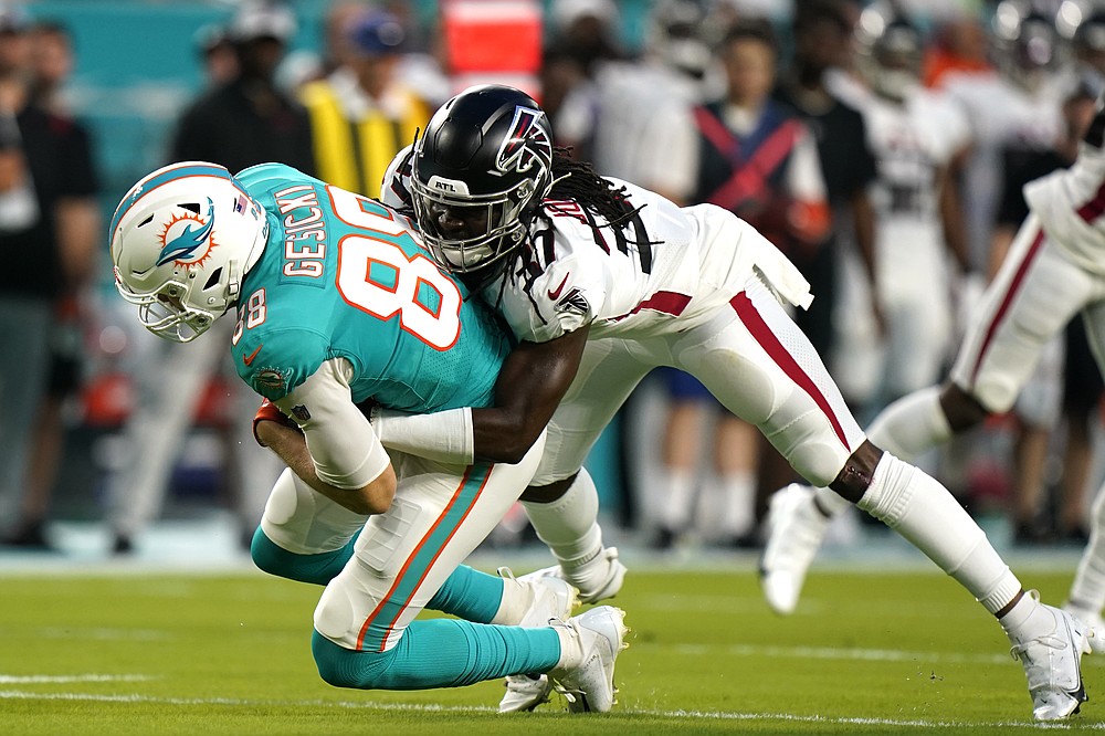 Miami Dolphins tight end Mike Gesicki (88) deflects the ball as