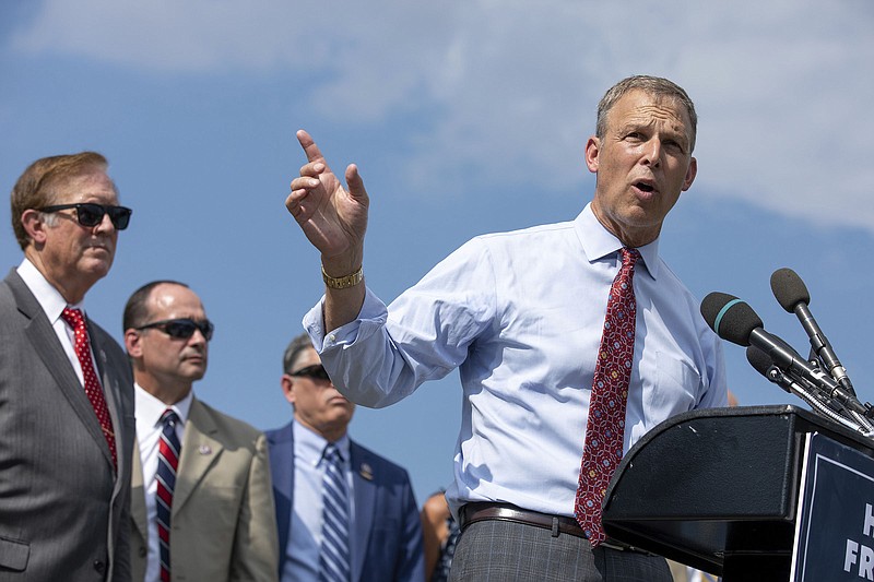 Rep. Scott Perry, R-Pa., takes a question from a reporter about the infrastructure bill making its way through congress during a news conference held by the House Freedom Caucus on Capitol Hill in Washington, Monday, Aug. 23, 2021. (AP Photo/Amanda Andrade-Rhoades)