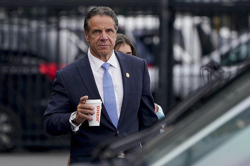 FILE - New York Gov. Andrew Cuomo prepares to board a helicopter after announcing his resignation, Tuesday, Aug. 10, 2021, in New York. Cuomo will resign in disgrace this week. His departure comes after a state investigation found he sexually harassed 11 women. It's a stunning reversal for a powerful politician who not that long ago was considered a possible contender for the White House. Observers and people who know Cuomo say his drive to dominate made him an effective governor. He passed landmark legislation and built new train stations, airports and bridges. But his accusers say the same habits also made him a bully who used his power to get what he wanted. They say he thought he could intimidate them into silence. (AP Photo/Seth Wenig)