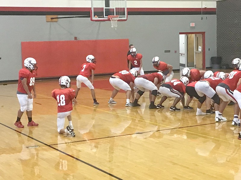 Al Gaspeny/Special to McDonald County Press
The Mustangs work on field goals Tuesday. The practice session was moved to the gym because the McDonald County soccer team was hosting a jamboree at Mustang Stadium.