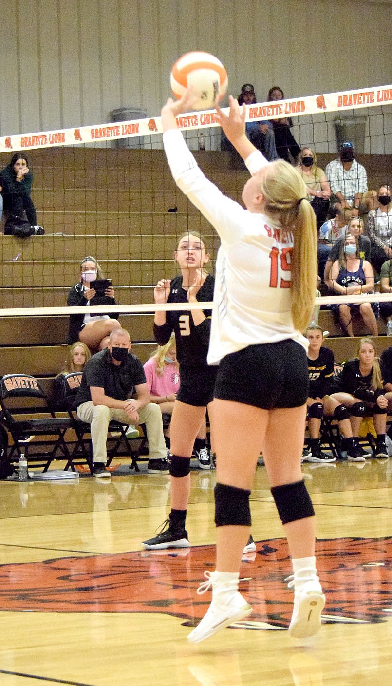 Westside Eagle Observer/MIKE ECKELS
Paige Greer (19) passes the ball to a teammate setting up a hit back into Lady Tiger territory during the Thursday night Gravette-Prairie Grove varsity volleyball match at the Competition Gym in Gravette.
