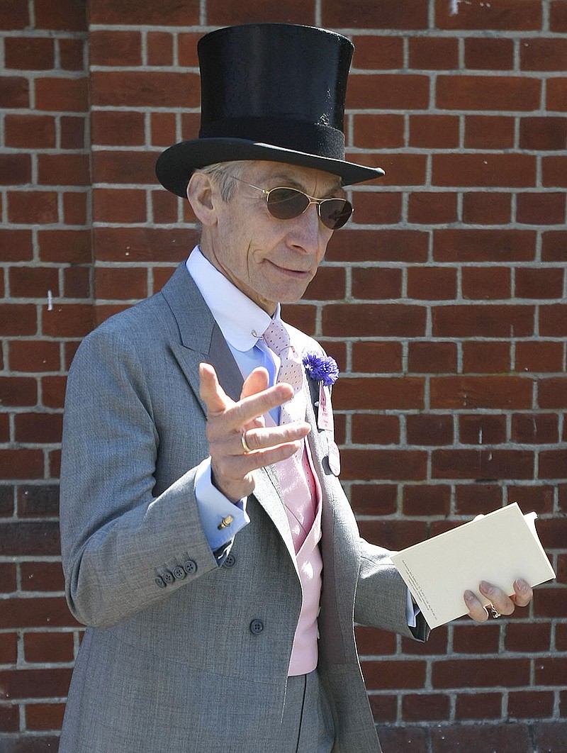 Charlie Watts, the drummer of the Rolling Stones, arrives on the third day of the Royal Ascot horse racing meeting at Ascot, England , Thursday, June, 17, 2010. (AP Photo/Alastair Grant )
