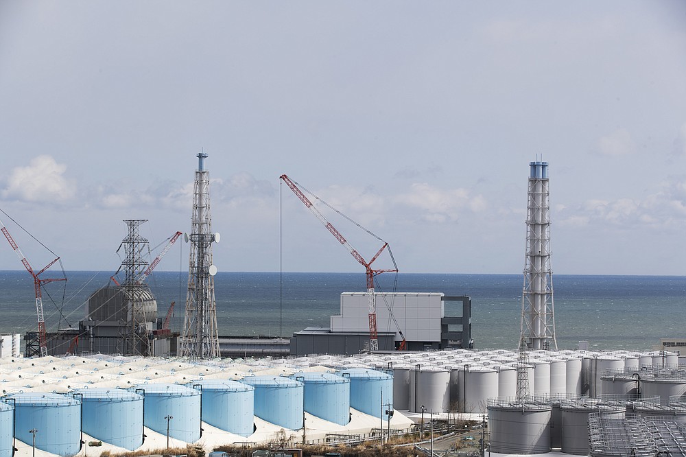 FILE - In this Feb. 27, 2021, file photo, the Pacific Ocean looks over nuclear reactor units of No. 3, left, and 4 at the Fukushima Daiichi nuclear power plant in Okuma town, Fukushima prefecture, northeastern Japan. (AP Photo/Hiro Komae, File)