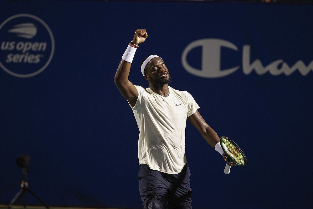 Frances Tiafoe, of the United States, reacts after defeating Thiago Monteiro, of Brazil, at the Winston-Salem Open tennis tournament in Winston-Salem, N.C., Wednesday, Aug. 25, 2021. (AP Photo/Nell Redmond)