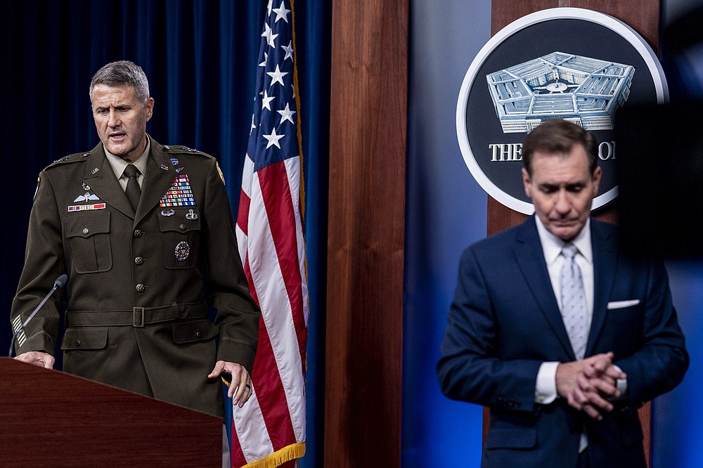 U.S. Army Major Gen. William Taylor, Joint Staff Operations, left, accompanied by Pentagon spokesman John Kirby, right, takes the podium to speak during a briefing at the Pentagon in Washington, Wednesday, Aug. 25, 2021. (AP Photo/Andrew Harnik)