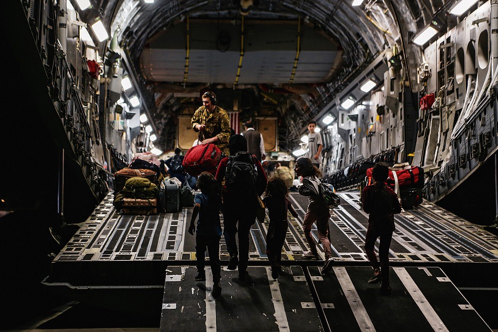 In this image provided by the U.S. Marine Corps, board a Boeing C-17 Globemaster III, at Hamid Karzai International Airport, Kabul, Afghanistan, Monday, Aug. 23, 2021. (Sgt. Isaiah Campbell/U.S. Marine Corps via AP)