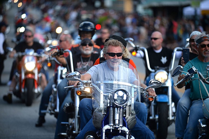 Motorcyclists ride along Dickson Street in Fayetteville during the 20th annual Bikes, Blues &amp; BBQ Motorcycle Rally in this Sept. 28, 2019, file photo. (NWA Democrat-Gazette/Andy Shupe)