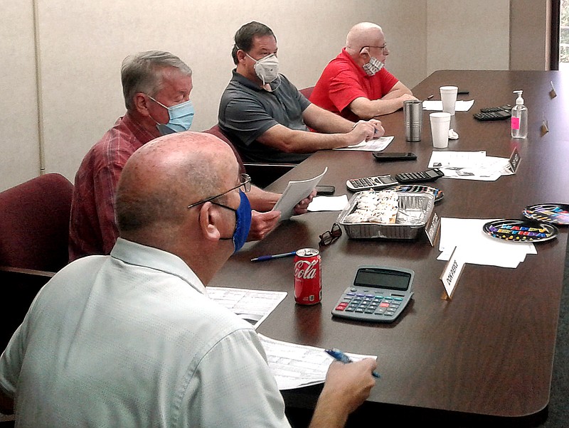 Garland County Equalization Board members, from left,  Don Pierce, Rodney Bottoms, Sean Edds and Larry Griffin, hear VIPA Hospitality Management's property tax appeal Thursday at the Garland County Government Office Building. - Photo by David Showers of The Sentinel-Record