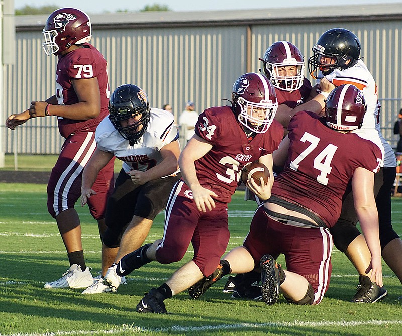 Westside Eagle Observer/RANDY MOLL
With the blocking of the Gentry line, running back William Pyburn carries the ball toward the goal line in Gentry's victory over Waldron in Pioneer Stadium on Friday night.