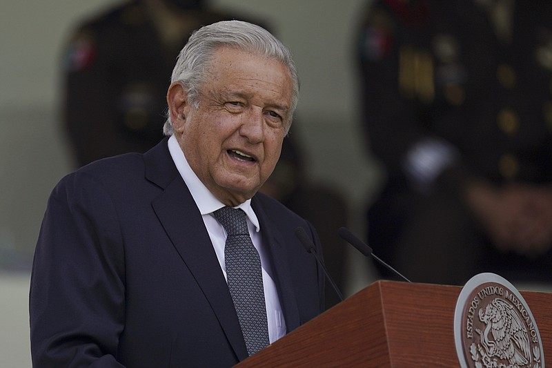 FILE - In this Aug. 13, 2021 file photo, Mexican President Andres Manuel Lopez Obrador speaks during a military parade introducing the new army commander in Mexico City. The SUV carrying L&#xf3;pez Obrador was stopped and surrounded by a teachers&#x2019; group Friday, Aug. 27, 2021 in the southern state of Chiapas, preventing him from leading his usual daily morning news conference. (AP Photo/Fernando Llano, File)