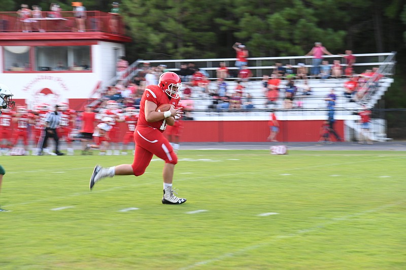 Mountain Pine junior James Glasco runs downfield after catching a pass to set up the Red Devils’ first touchdown against Episcopal Collegiate Friday night. - Photo by Tanner Newton of The Sentinel-Record