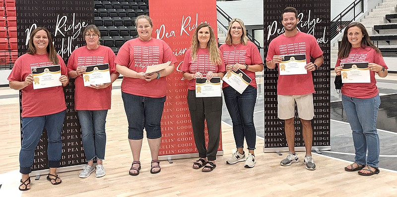 Honored for 10 years of service to the Pea Ridge School District were Amber Bowen, Cathy Caudle, Valerie Hooten, Olivia Laine, Trent Loyd, Michael Patton, Jessica Woods, Tisha Jordan, Cameron McNabb and Brandy O&#x2019;Dell.