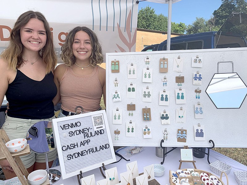 LYNN KUTTER ENTERPRISE-LEADER
Sydney Roland, left, and Autumn Benedict, both Prairie Grove graduates, will set up their booth Ivy Clay Designs at the Clothesline Fair over Labor Day weekend. They make their clay jewelry in their apartment in Fayetteville.