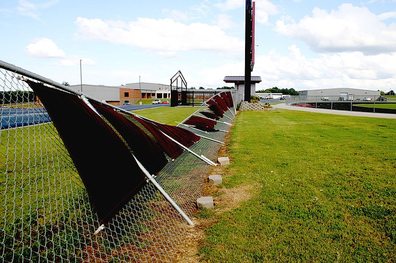 LYNN KUTTER  ENTERPRISE-LEADER/The fence along the northern entrance to Lincoln's Wolfpack Stadium sustained storm damage Thursday.