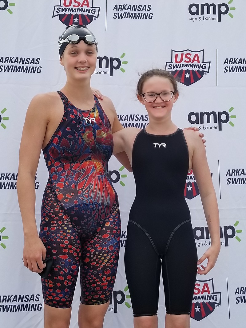 Emma Crowe, left, and Aubrey Schmitt recently competed at the 2021 Arkansas State Swimming Championships at Melvin Ford Aquatic Center in Bentonville. - Photo submitted