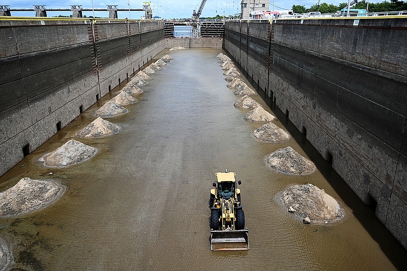 Construction crews from the U.S. Army Corps of Engineers, Little Rock District work on a section of the David D. Terry lock during the dewatering  on Monday, Aug. 30, 2021.

(Arkansas Democrat-Gazette/Stephen Swofford)