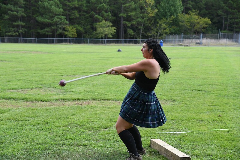 Abigail Lee spins a hammer that she is about to throw. - Photo by Tanner Newton of The Sentinel-Record