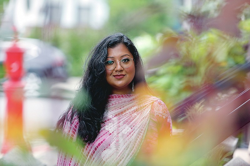 ADVANCE FOR PUBLICATION ON TUESDAY, SEPT. 7, AND THEREAFTER - Shahana Hanif, a community organizer strongly favored to win a seat on the New York City Council in the upcoming municipal election, stands in front of her home in the Kensington neighborhood of the Brooklyn borough of New York, on Wednesday, Aug. 18, 2021. In 2001, mere weeks after the twin towers at the World Trade Center fell, car passed, the driver&#x2019;s window rolled down and the man spat an epithet at two little girls wearing their hijabs: &#x201c;Terrorist!&#x201d; as a 10-year-old Shahana and her younger sister were walking to the local mosque from their Brooklyn home. Unsure, afraid, the girls ran. (AP Photo/Emily Leshner)