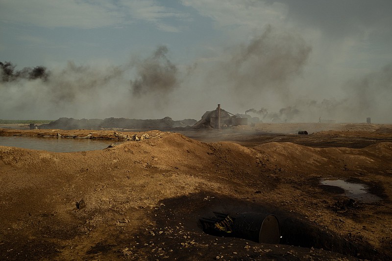 Burn-off and smoke from makeshift oil refineries fills the skies in the northeast region of Syria in August 2021. MUST CREDIT: photo for The Washington Post by Nicole Tung.