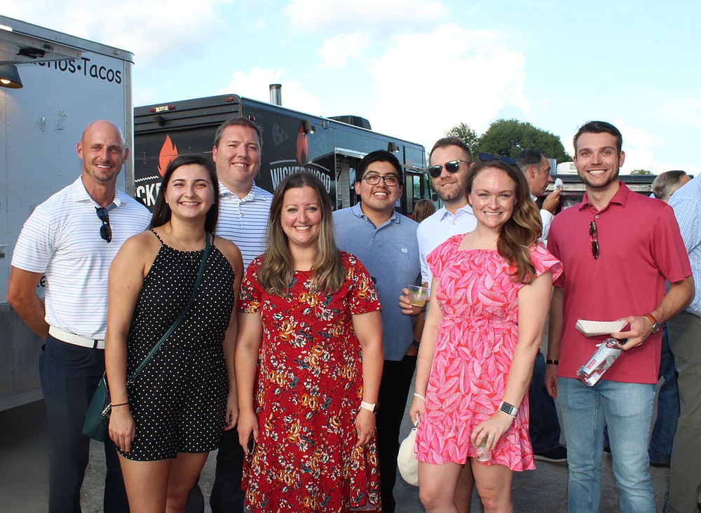 Mike Klaas (from left), Kaycee Hightower, Matt Malone, Shelby Manning, Jonathan Rojo, Eric Plummer, Ashley Garske and Caleb Gray represent General Mills and help support the Boys & Girls Club of Benton County at Sip & Savor on Aug. 19 in Rogers.
(NWA Democrat-Gazette/Carin Schoppmeyer)