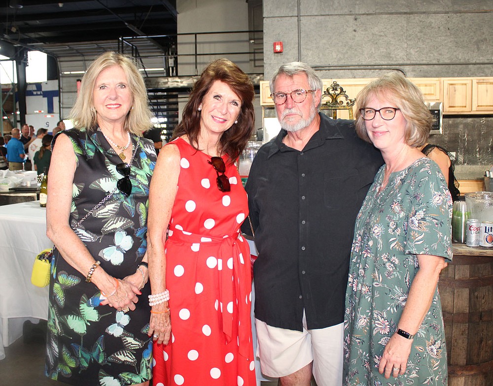 Claire Klinker (from left), Cynthia Coughlin and Tom and Ruthanne Hough visit at Sip & Savor.
(NWA Democrat-Gazette/Carin Schoppmeyer)
