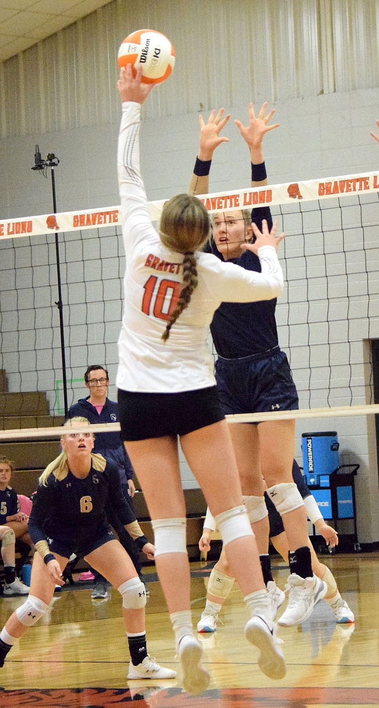 Westside Eagle Observer/MIKE ECKELS
Lady LIon Keeley Elsea (10) tips the ball over the net back into the Lady Saint side of the court during the second set of the Gravette-Shiloh Christian volleyball match in Gravette Thursday night. The Lady Saints captured the win over the Lady Lions in three straight sets.
