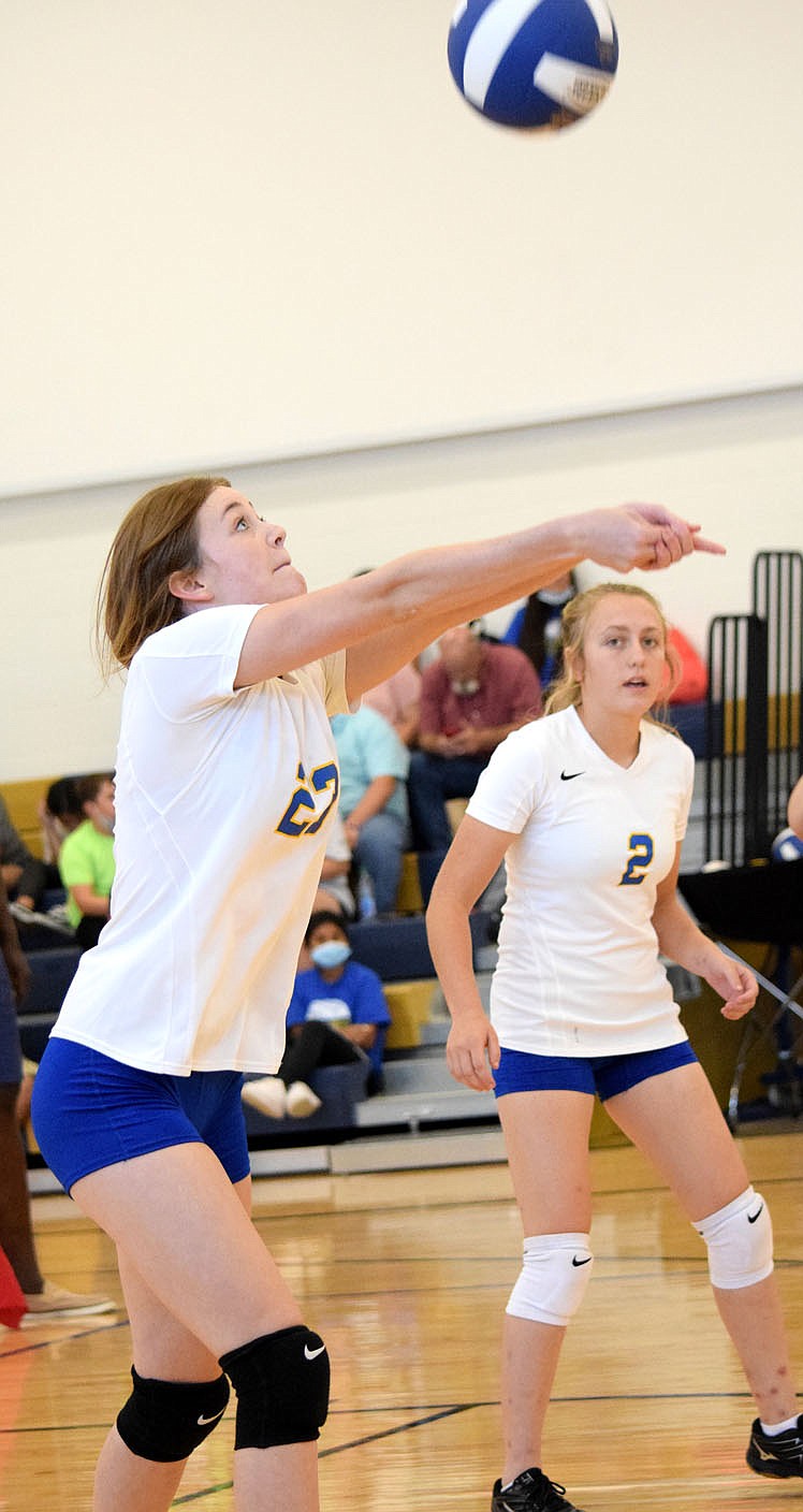 Westside Eagle Observer/MIKE ECKELS
Lady Bulldog Brooklyn Todd (left) returns the ball back over the net into the Lady Yellowjackets' side of the court during the third set of the Decatur-Mulberry varsity volleyball match in Decatur Aug. 31. Decatur took its first win of the 2021 season.