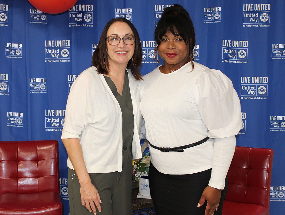 Missy Cole (left) and Helena Gadison, UWNWA board members, stand for a photo at the kickoff luncheon.
(NWA Democrat-Gazette/Carin Schoppmeyer)