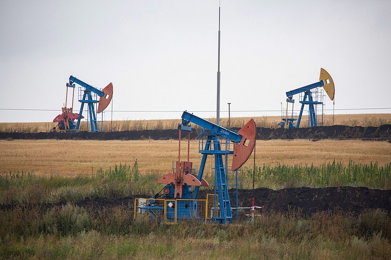 Oil pumping jacks operate in an oilfield near Almetyevsk, Russia, on Aug. 16, 2020. MUST CREDIT: Bloomberg photo by Andrey Rudakov.