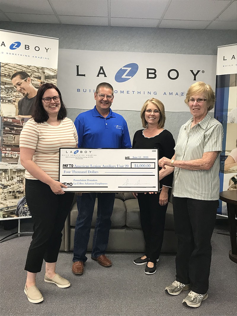 Photo submitted On June 15, Farrell (second from right), presents a check for $4,000 to the Siloam Springs American Legion Auxiliary from the La-Z-Boy Cares foundation. La-Z-Boy Cares helps communities they are in by donating funds to organizations that serve those communities. Pictured with Farrell are Auxiliary President Riley Overstreet (left); La-Z-Boy Environmental Health and Safety Manager Jim Larson and Auxiliary Treasurer Carol Smith.