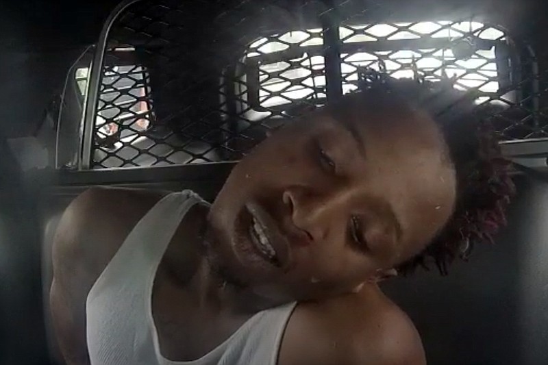 Texarkana Texas Police Department 
This screen capture from a Texarkana Texas Police Department dashboard camera shows Darren Boykin in the back seat of a patrol vehicle after his arrest Aug. 29, 2019. Boykin later died while still in police custody. His mother has sued the department for wrongful death.