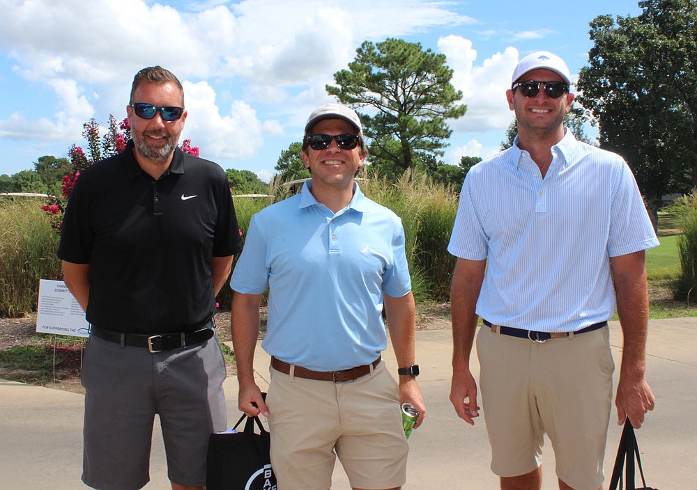 Jason Fremstad (left to right), Jarrod Anderson and Corey Bartlett play in the Golf Classic. (NWA Democrat-Gazette / Carin Schoppmeyer)