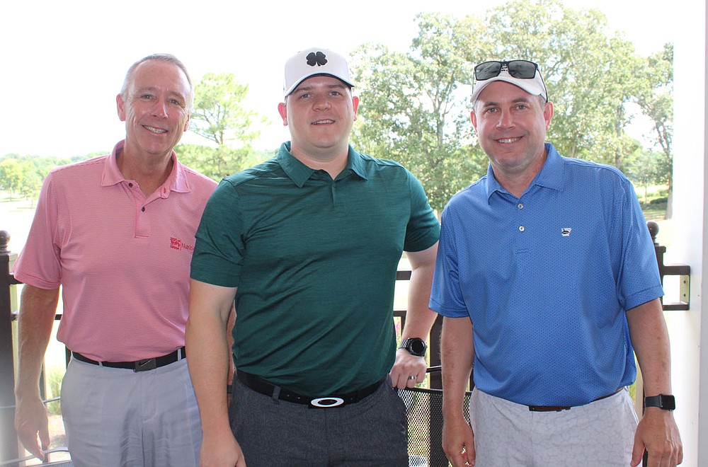 Gregg Hoeldtke (left to right), Benjamin Orr and Aaron Jackson help support the children's shelter. (NWA Democrat-Gazette / Carin Schoppmeyer)