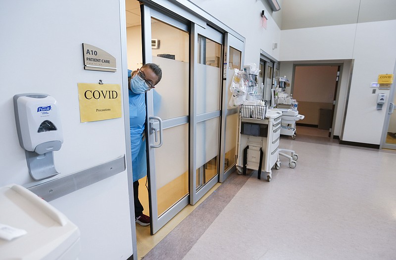 A nurse looks out from a covid-19 room in the CoxHealth Emergency Department in Springfield, Mo., in this July 2021 file photo. (AP/The Springfield News-Leader/Nathan Papes)