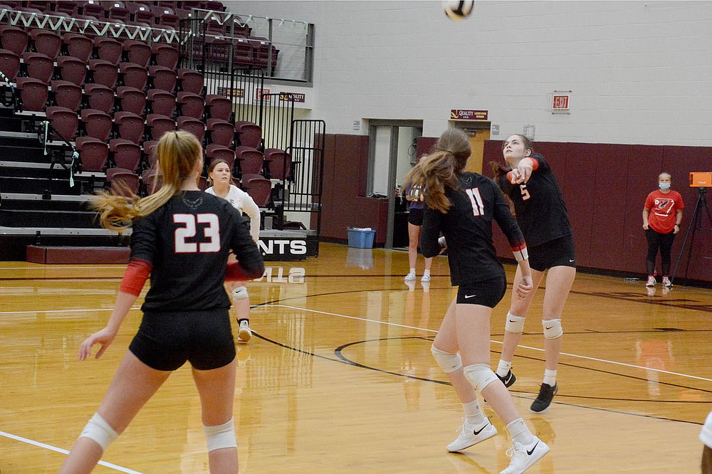 Graham Thomas/Herald-Leader
Pea Ridge senior Lauren Wright digs up a ball during Thursday's match at Siloam Springs.