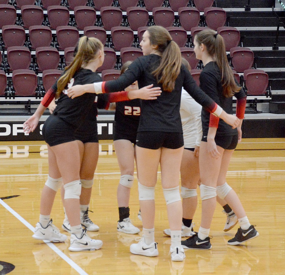 Graham Thomas/Herald-Leader
Pea Ridge players huddle during a break in the action Thursday at Siloam Springs.