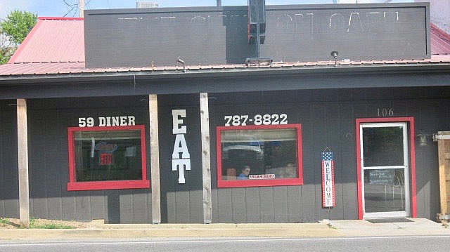Westside Eagle Observer/SUSAN HOLLAND
The "Open" sign is flashing in the window at 59 Diner Thursday afternoon, Sept. 2, and the EAT sign invites diners to come in and enjoy a meal. Carol Thompson and Mike Wilson opened the diner at 106 1st Ave. N.E. near the end of July after several months of remodeling. Open hours are 10:45 a.m. to 8 p.m. Thursday through Saturday and 10:45 a.m. to 7 p.m. Sunday.