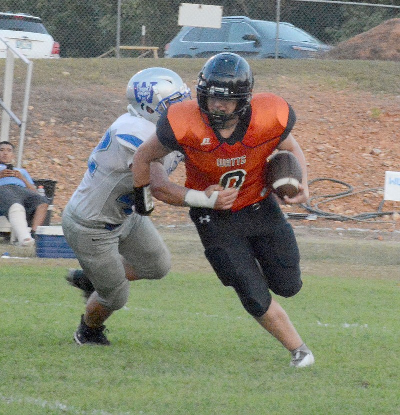 Graham Thomas/Siloam Sunday
Watts (Okla.) quarterback Skyler Payne tries to run away from a Welch (Okla.) defender during Friday's game in Watts.