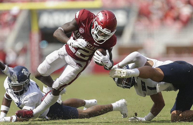 Arkansas running back Trelon Smith (22) carries the ball during the third quarter of the football game at Donald W. Reynolds Razorback Stadium in Fayetteville on Sept. 4, 2021. The Razorbacks defeated Rice 38-17. - Photo by Charlie Kaijo of NWA Democrat-Gazette