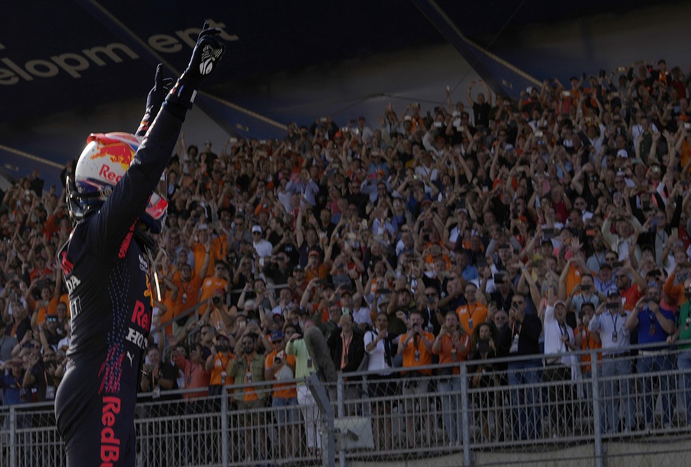 Red Bull driver Max Verstappen of the Netherlands celebrates after winning the Formula One Dutch Grand Prix, at the Zandvoort racetrack, Netherlands, Sunday, Sept. 5, 2021. (AP Photo/Francisco Seco)