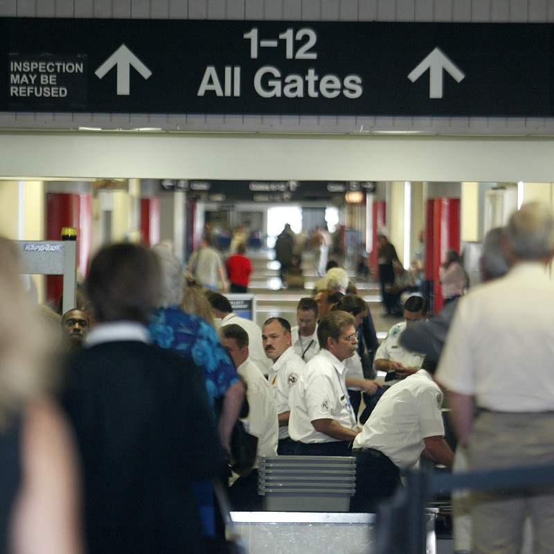 Arkansas Democrat-Gazette/STATON BREIDENTHAL --10/1/02--Transportation Security Administration(TSA) federal passenger screeners check passengers at the Little Rock National Airport Tuesday morning.  Yesterday was the first day for screeners hired and trained by the TSA to be on the job at the Little Rock airport.